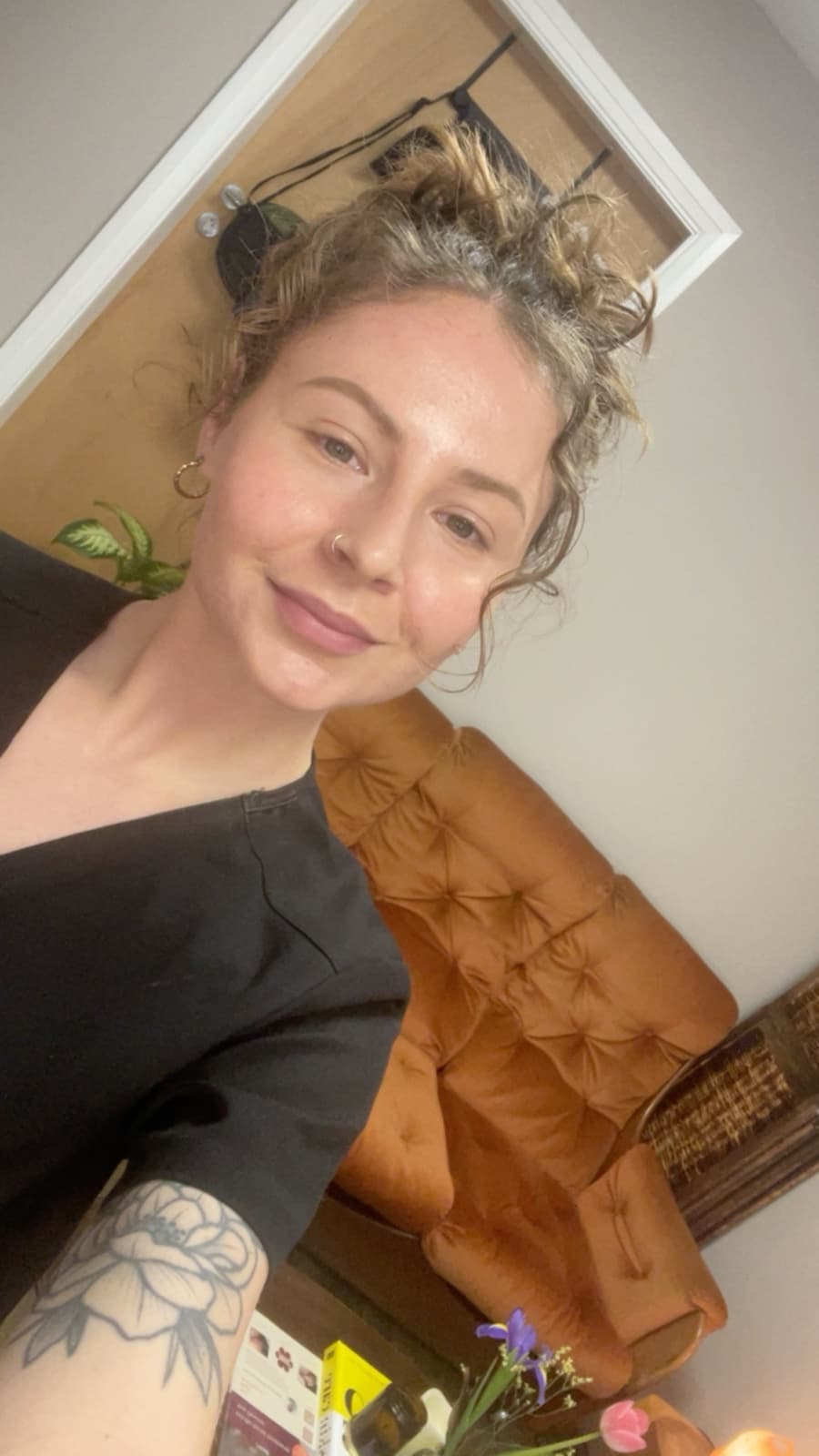 Zoe, founder and skincare specialist at Fresh Faced Skin Clinic in Scartho, Grimsby, smiling in the welcome corner.